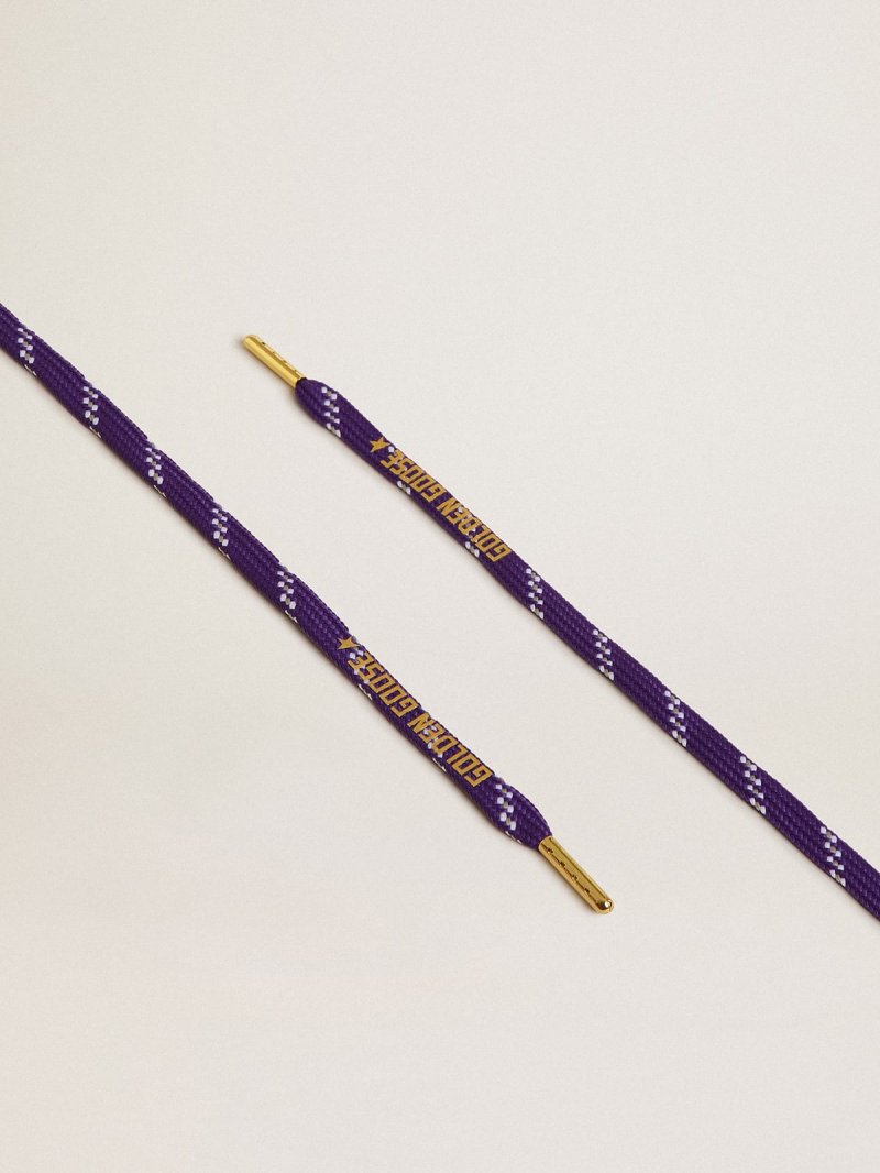 Purple laces with decorations and contrasting gold-colored logo